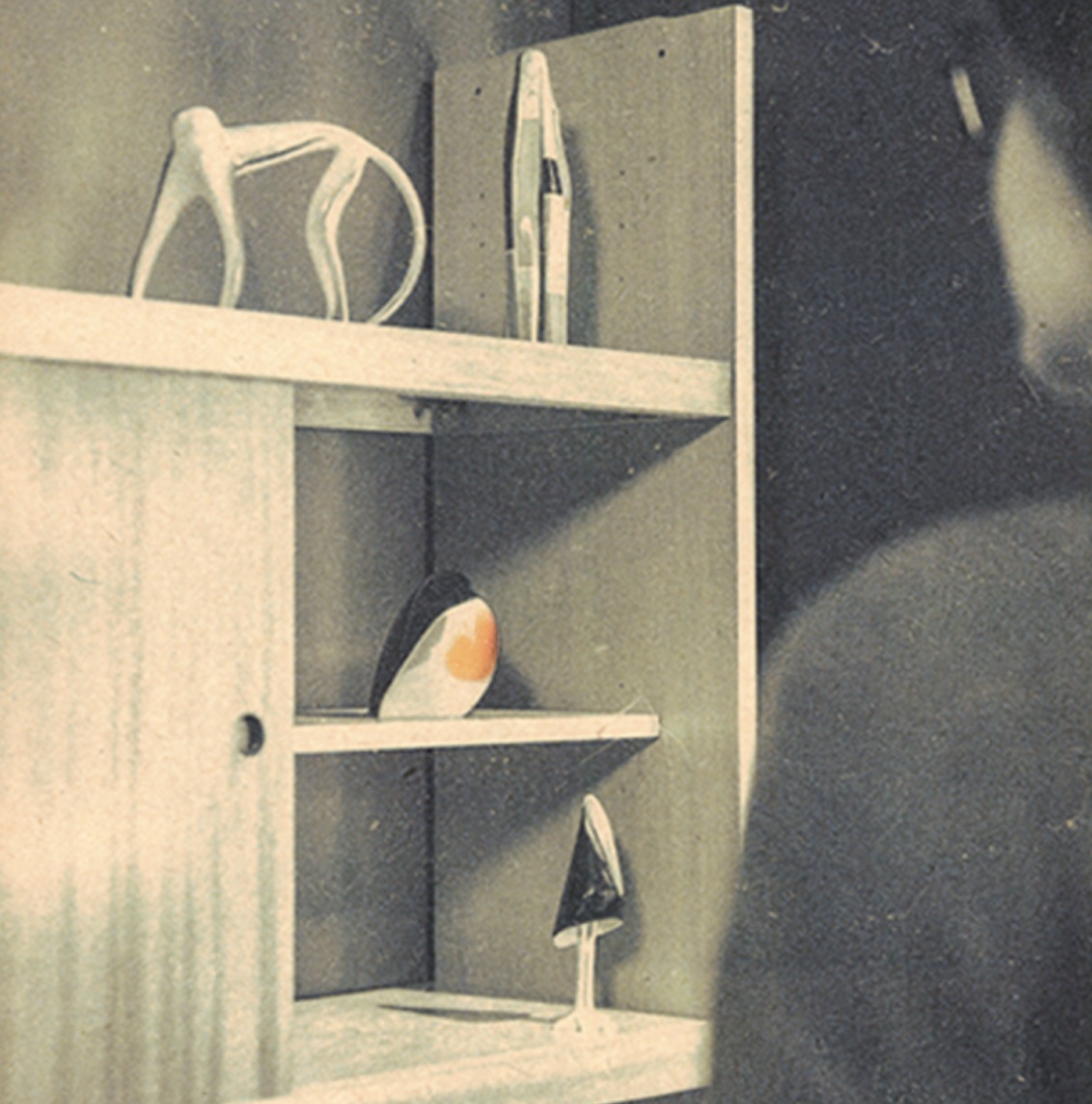 Ceramic figurines on a shelf unit, the kind that stood in Polish flats for decades